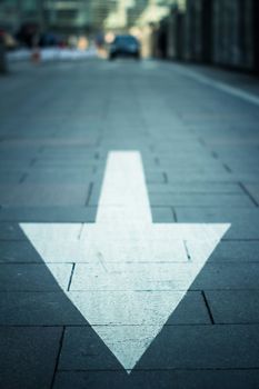 arrow on the road in city