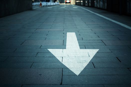 arrow on the road in city