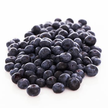 Picture of lots of blueberries over a white background