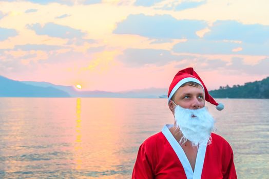 Portrait of Santa Claus on a background of the sea
