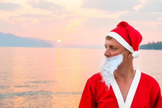 a man dressed as Santa Claus on the sea