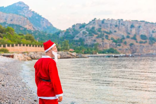 Santa Claus in the summer sea