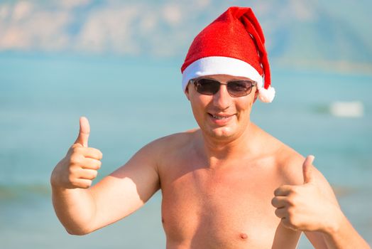 happy santa claus on vacation at sea