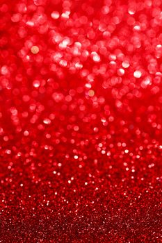 Abstract glitter bokeh holiday red background