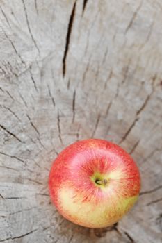 Apple lying on a wooden surface
