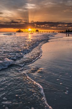 The beautiful sun setting on the shores of Fort Myers Beach located on Estero Island in Florida, United States of America