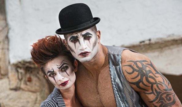 Strange pair of male and female cirque performers