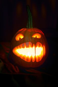 Halloween pumpkin with scary face on black backgound