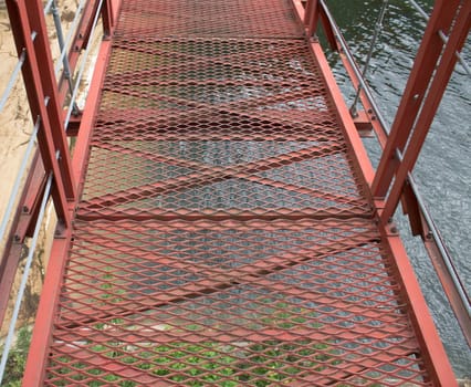 iron bridge red across the river. North Korea.