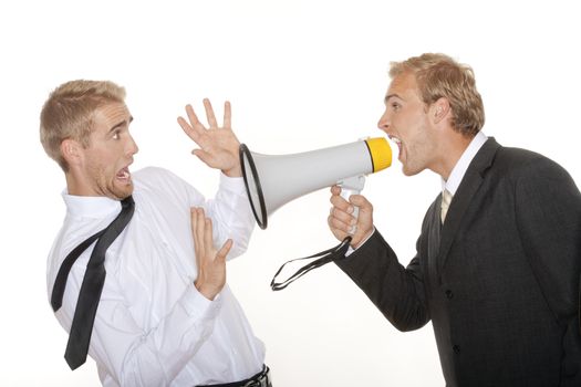 angry boss in suit yelling into a megaphone to scared employee - isolated on white