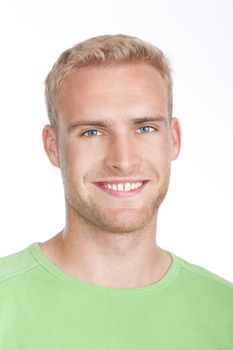 portrait of a young man with blond hair smiling - isolated on white