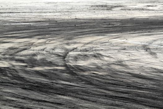 Background with tire marks on road track