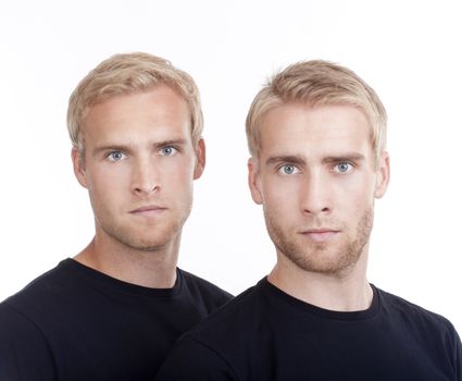 portrait of young twin brothers with blond hair and blue eyes - isolated on white