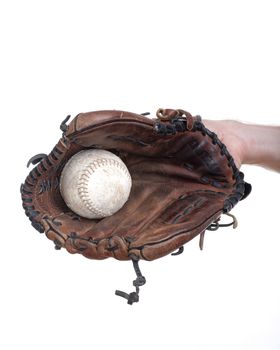 hand with a baseball glove with the ball in it - isolated on white