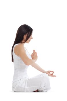 woman sitting on the floor exercising yoga - isolated on white