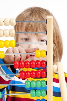 Boy Counting on Colorful Wooden Abacus - Isolated on White