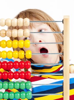 Boy Counting on Colorful Wooden Abacus Yawning - Isolated on White