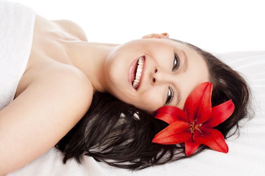 Happy Young Woman Lying on her Back in Spa Relaxing