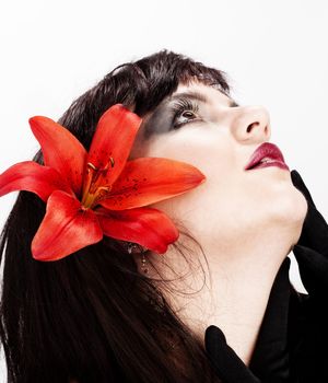 Portrait of a Beautiful Young Woman with Red Lily - Isolated on White