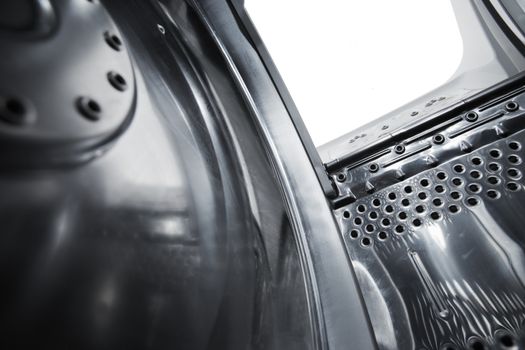 Interior view of a new european top loading washing machine. Very short depth-of-field.