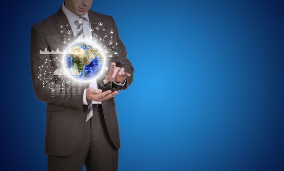Businessman in suit hold empty copy space. Earth and network with people icons. Elements of this image are furnished by NASA