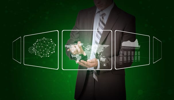 Businessman in suit hold empty copy space. Transparent rectangles, network, wire-frame spheres and world map on green background
