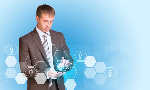 Businessman in suit hold empty copy space. Hexagons with people icons and transparent rectangles on blue background