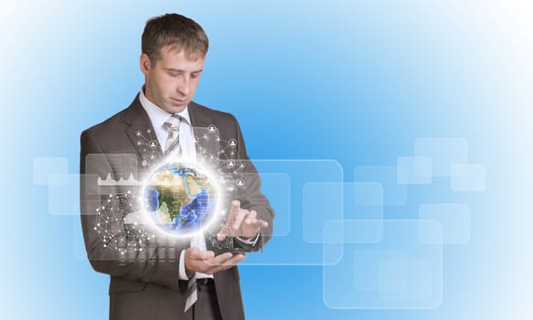 Businessman in suit hold empty copy space. Earth with graphs and network. Elements of this image are furnished by NASA