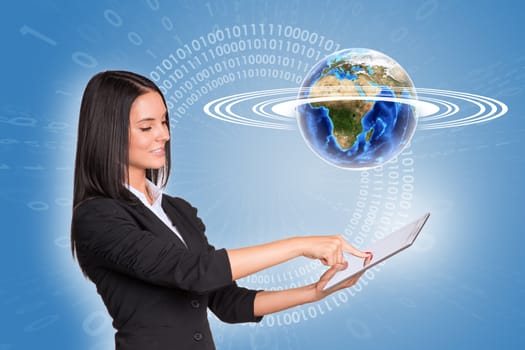 Beautiful businesswoman in suit using tablet and Earth with figures on blue background. Element of this image furnished by NASA