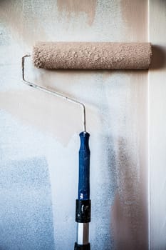 Closeup of a Paint Roller on the Wall