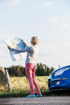 Lost Woman on a Rural Scene Looking at a Map