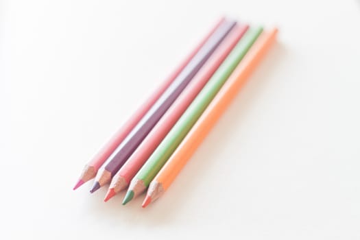 Color pencils on wooden background, stock photo