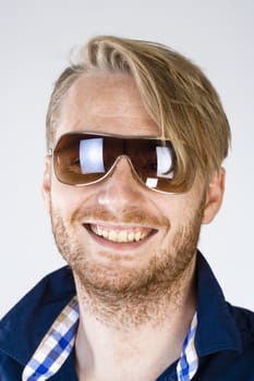 Portrait of a Young Man with Sunglasses - Isolated on Gray