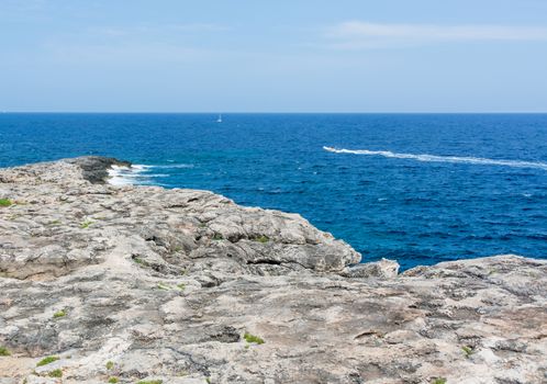 Rock form and ultramarine ocean. Mallorca, Balearic islands, Spain in July.