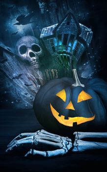 Black pumpkin with skeleton hand against eerie background