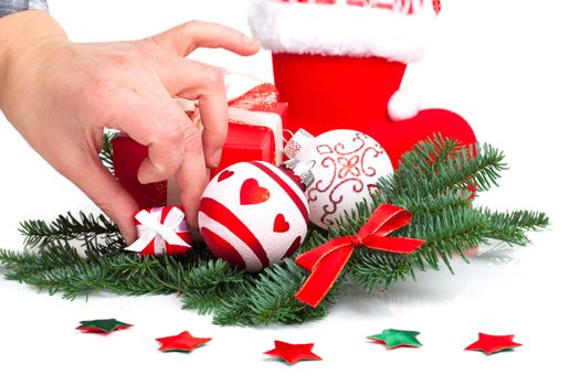 Christmas balls and fir branches with decorations isolated over white