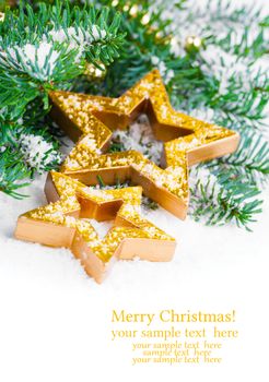 Golden Christmas stars with pine branch and snow, with free space for your text