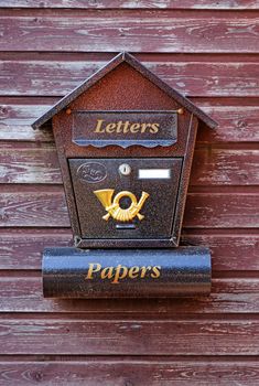 Mailbox on a wooden gate close-up                               