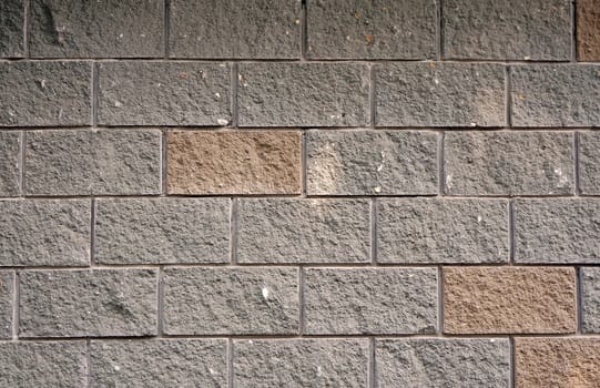 The wall of the large gray and red rectangular stones as background                               