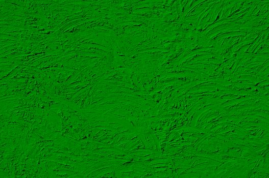 The texture of green walls painted large erratic strokes of paint                               