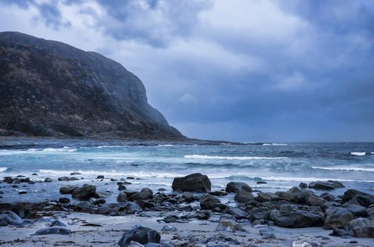 An evening at the seaside while darkness falls and in rainy weather.  

The photo is taken at Alnes in Norway, Scandinavia