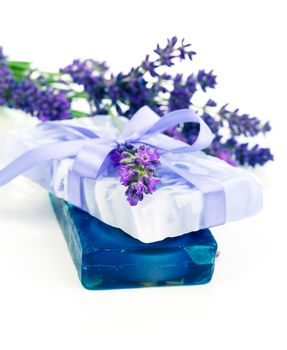 natural herbal lavender soap with fresh blossoms isolated on white background