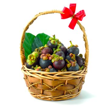 mangosteen thai fruit in basket isolated on white background