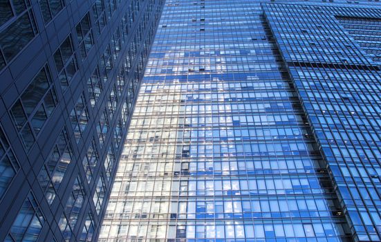 glass wall of office building,with reflection of clouds