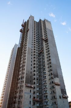 one tall building under construction,low angle