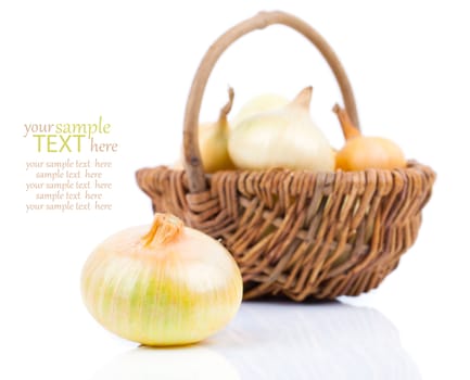 onion bulb in wicker basket, isolated on white background