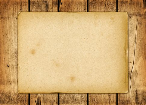 Blank vintage paper sheet on a wood board panel