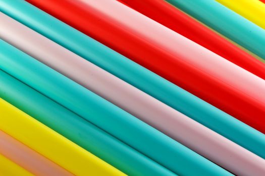 Photo presents details of colourful plastic straws patterns.