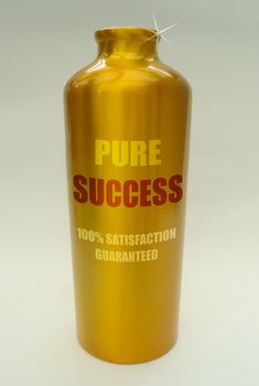 Success 'bottled' in a gold container, as a metaphor for wealth, achievement and motivation