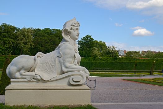 Photo shows general view of statue in garden of Belvedere Palace.